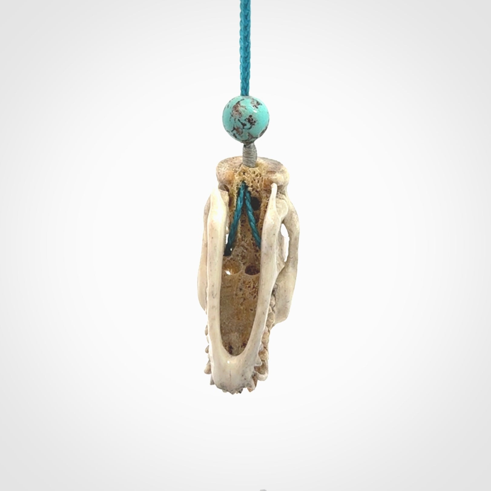 This is a hand carved deer antler cat skull pendant. It is made from deer antler, bone. This is a large sized necklace and is a very unique, one only, pendant that is a collectors piece. Hand carved deer antler cat skull necklace for men and women.