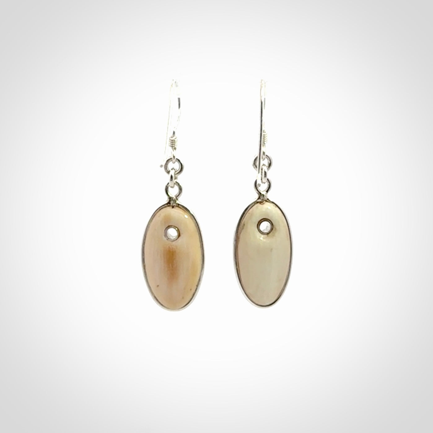 Hand carved woolly mammoth tusk earrings. Hand made by NZ Pacific for sale online.