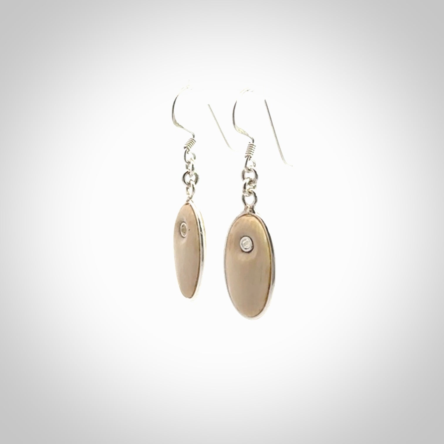 Hand carved woolly mammoth tusk earrings. Hand made by NZ Pacific for sale online.