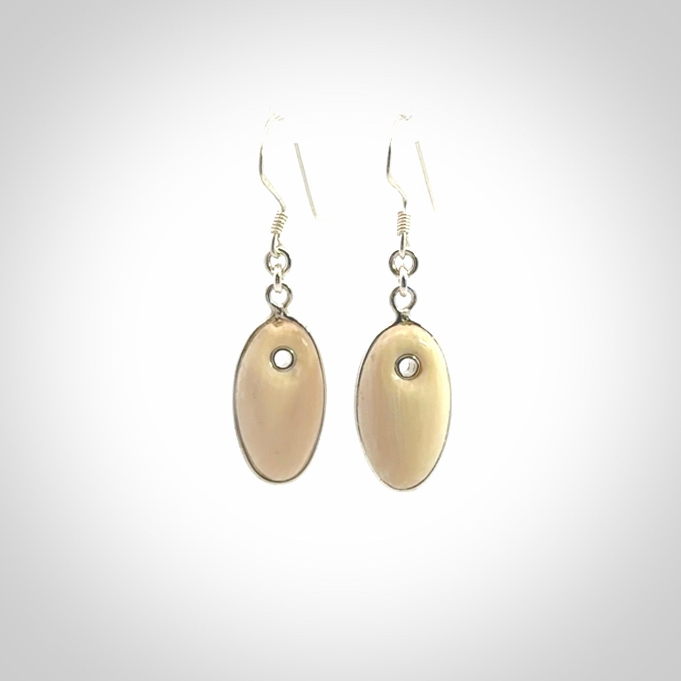 Hand carved woolly mammoth tusk earrings. Hand made by NZ Pacific for sale online.