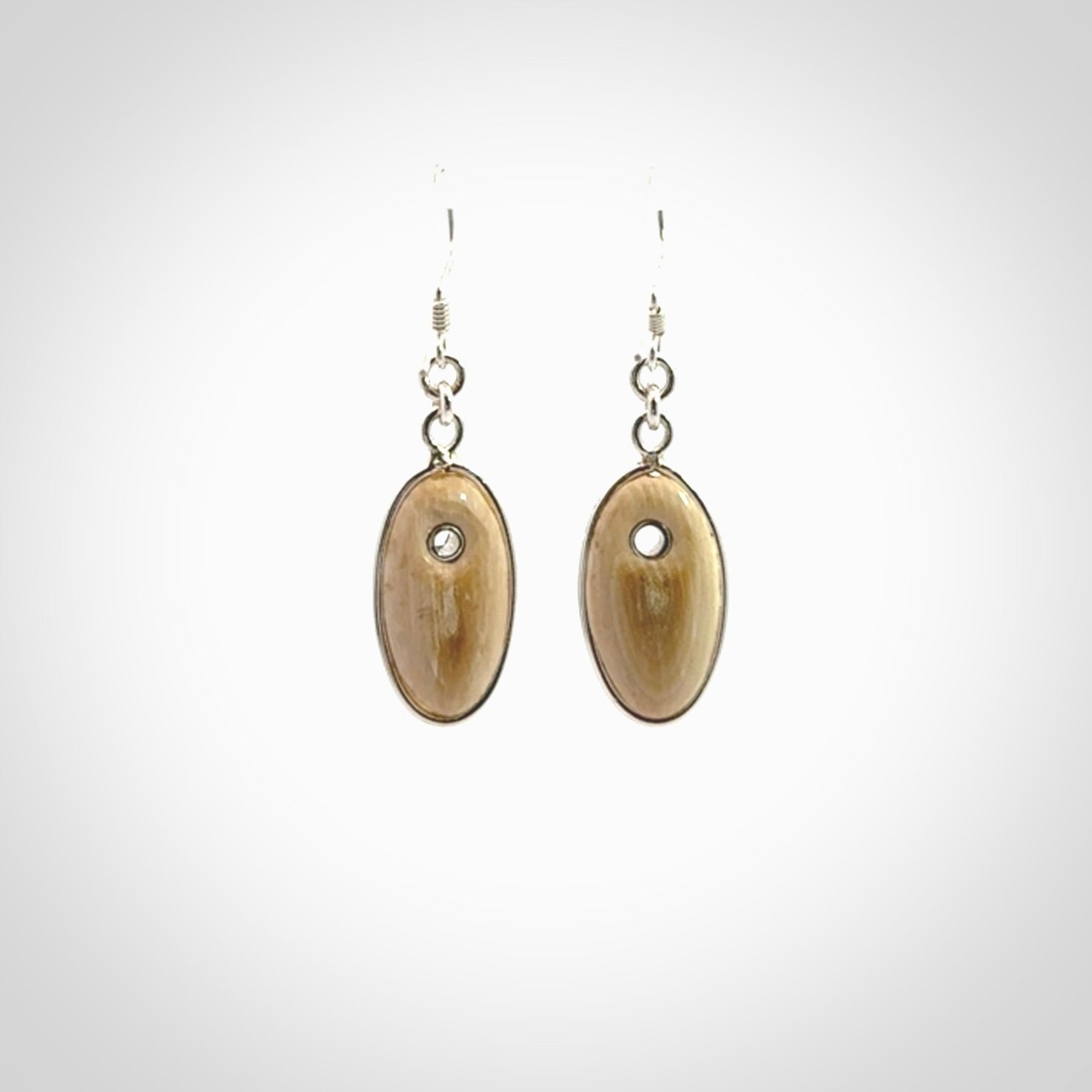 Hand carved woolly mammoth tusk earrings. Hand made by NZ Pacific for sale online.