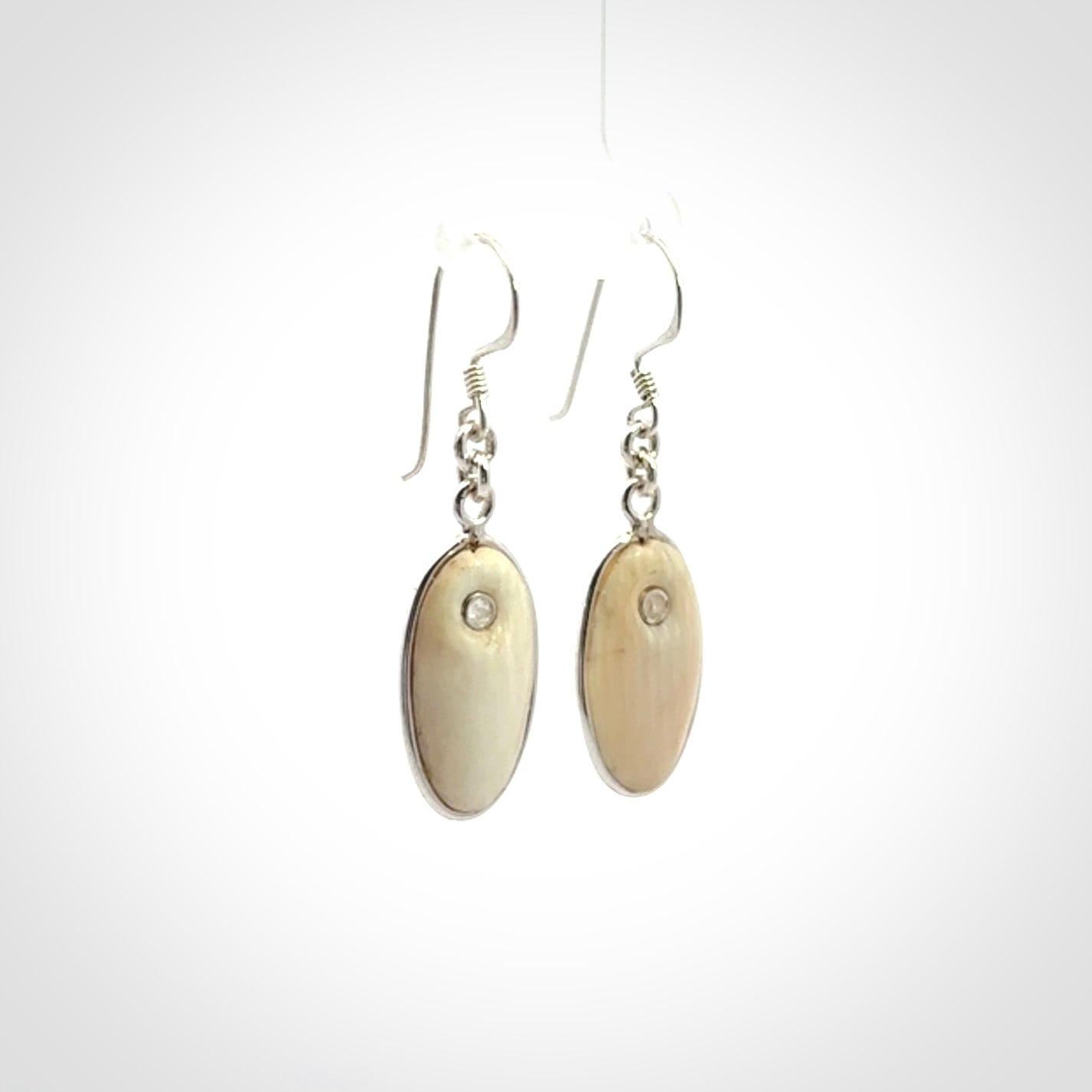 Hand carved woolly mammoth tusk earrings. Hand made by NZ Pacific for sale online.