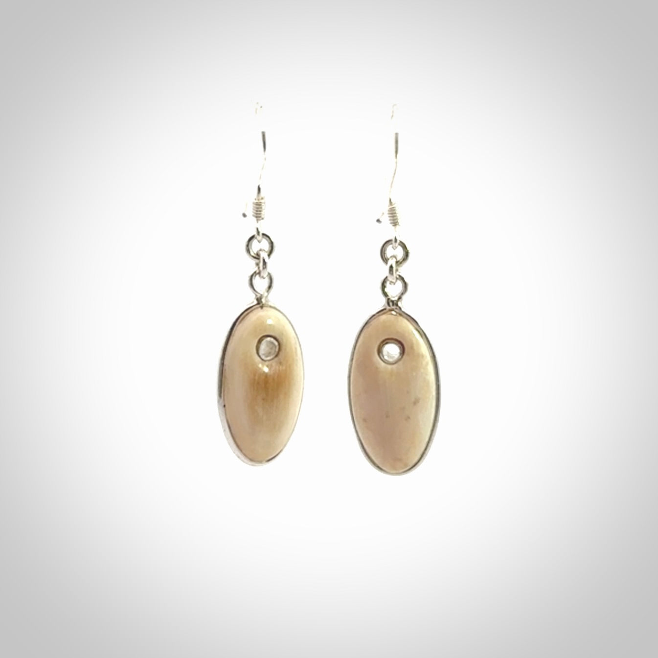 Hand carved woolly mammoth tusk earrings. Hand made by NZ Pacific for sale online.