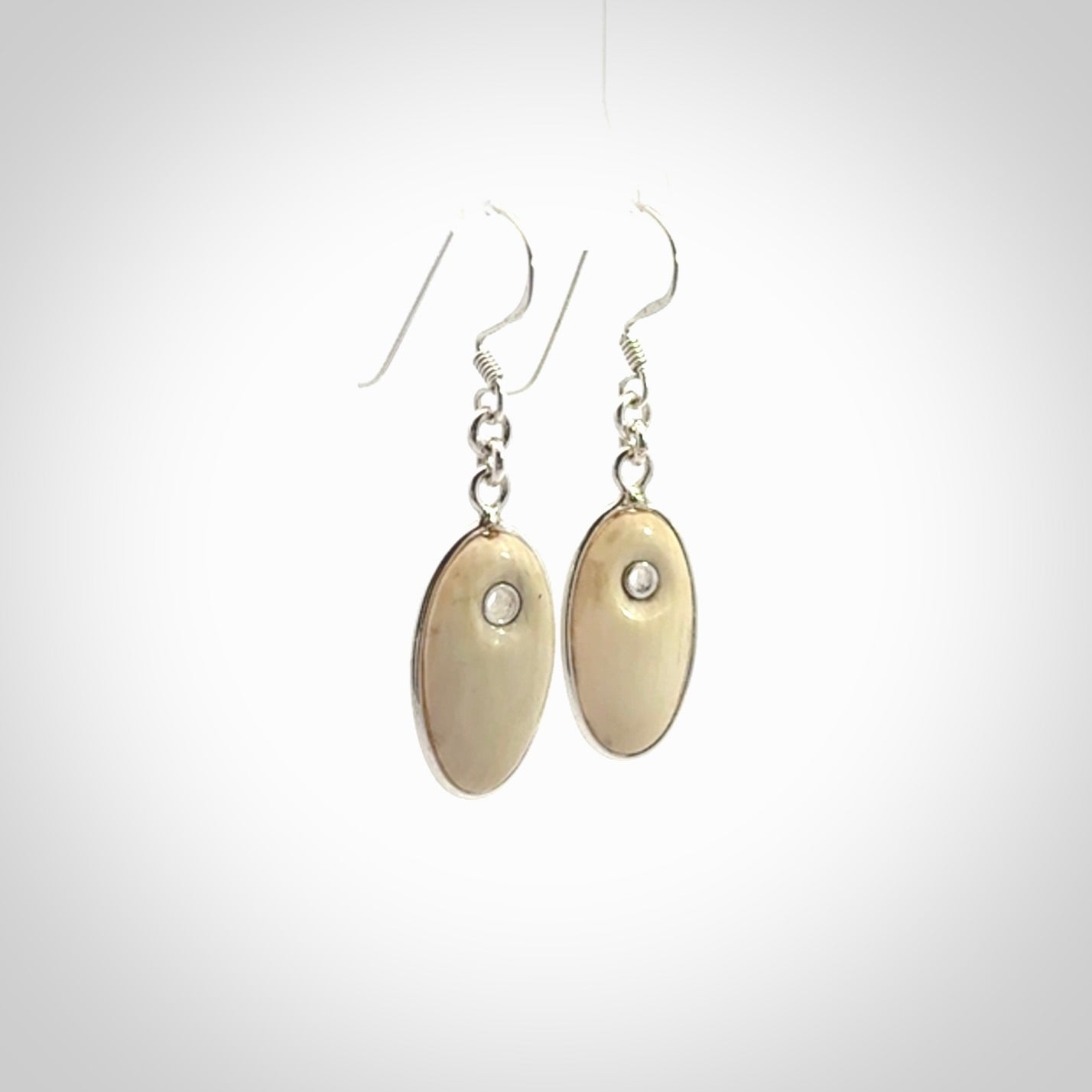 Hand carved woolly mammoth tusk earrings. Hand made by NZ Pacific for sale online.