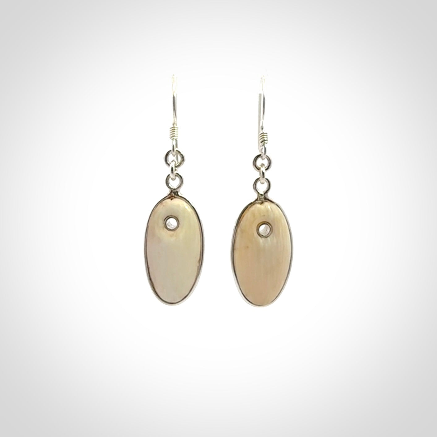 Hand carved woolly mammoth tusk earrings. Hand made by NZ Pacific for sale online.