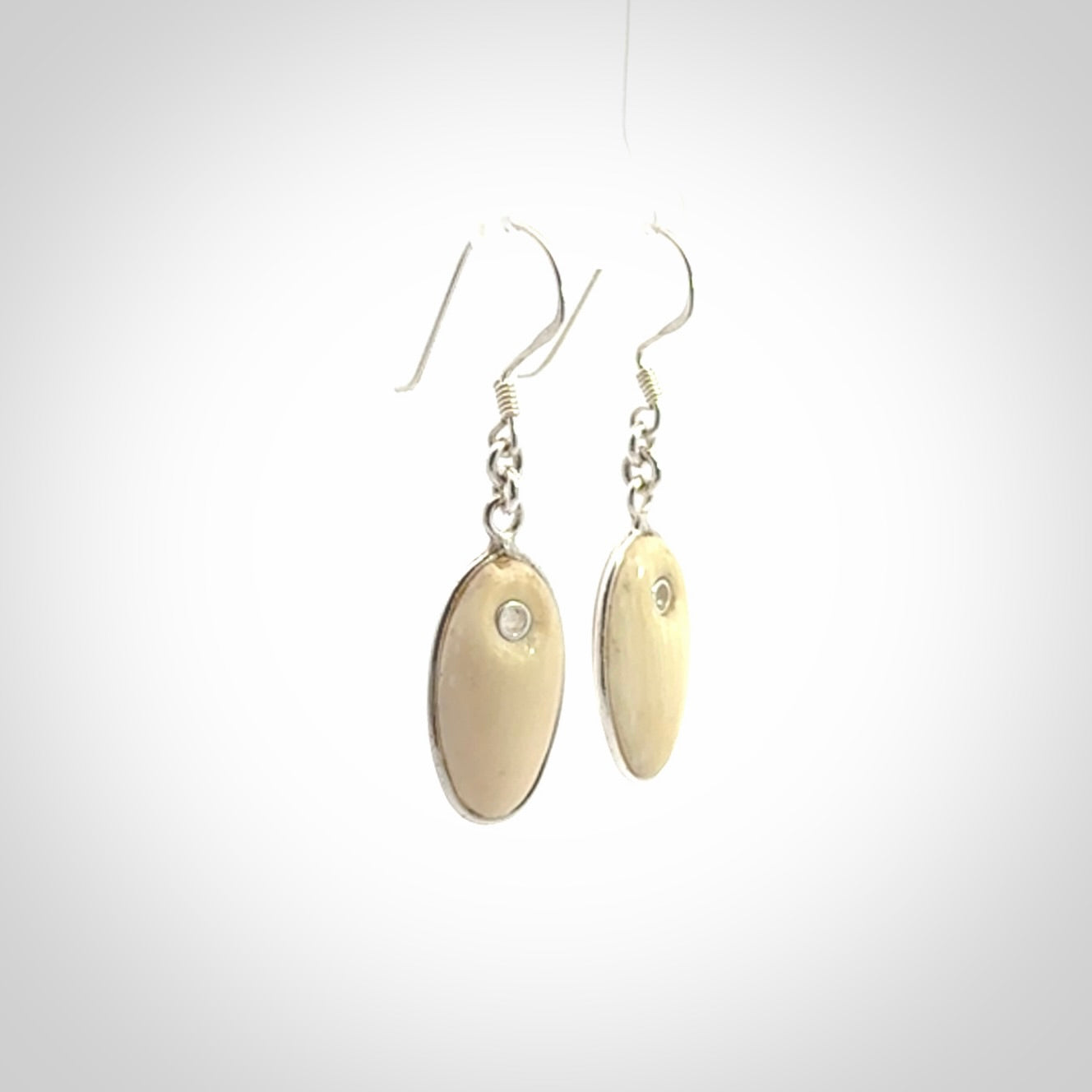 Hand carved woolly mammoth tusk earrings. Hand made by NZ Pacific for sale online.
