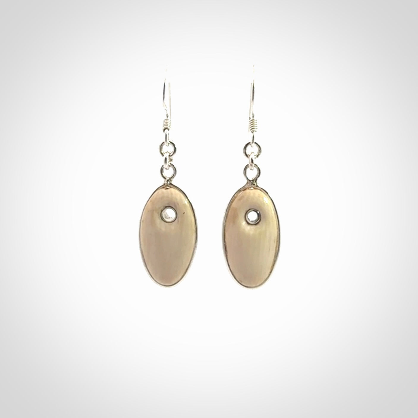 Hand carved woolly mammoth tusk earrings. Hand made by NZ Pacific for sale online.