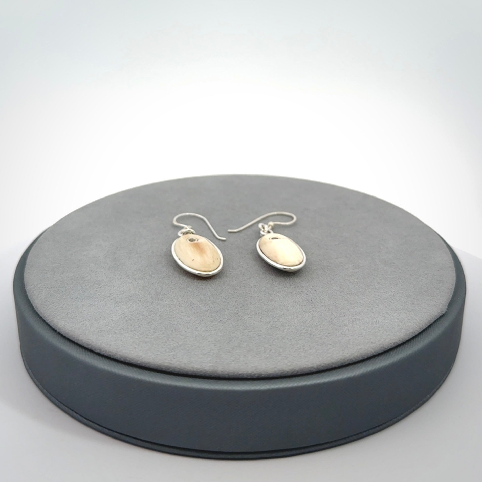 Hand carved woolly mammoth tusk earrings. Hand made by NZ Pacific for sale online.