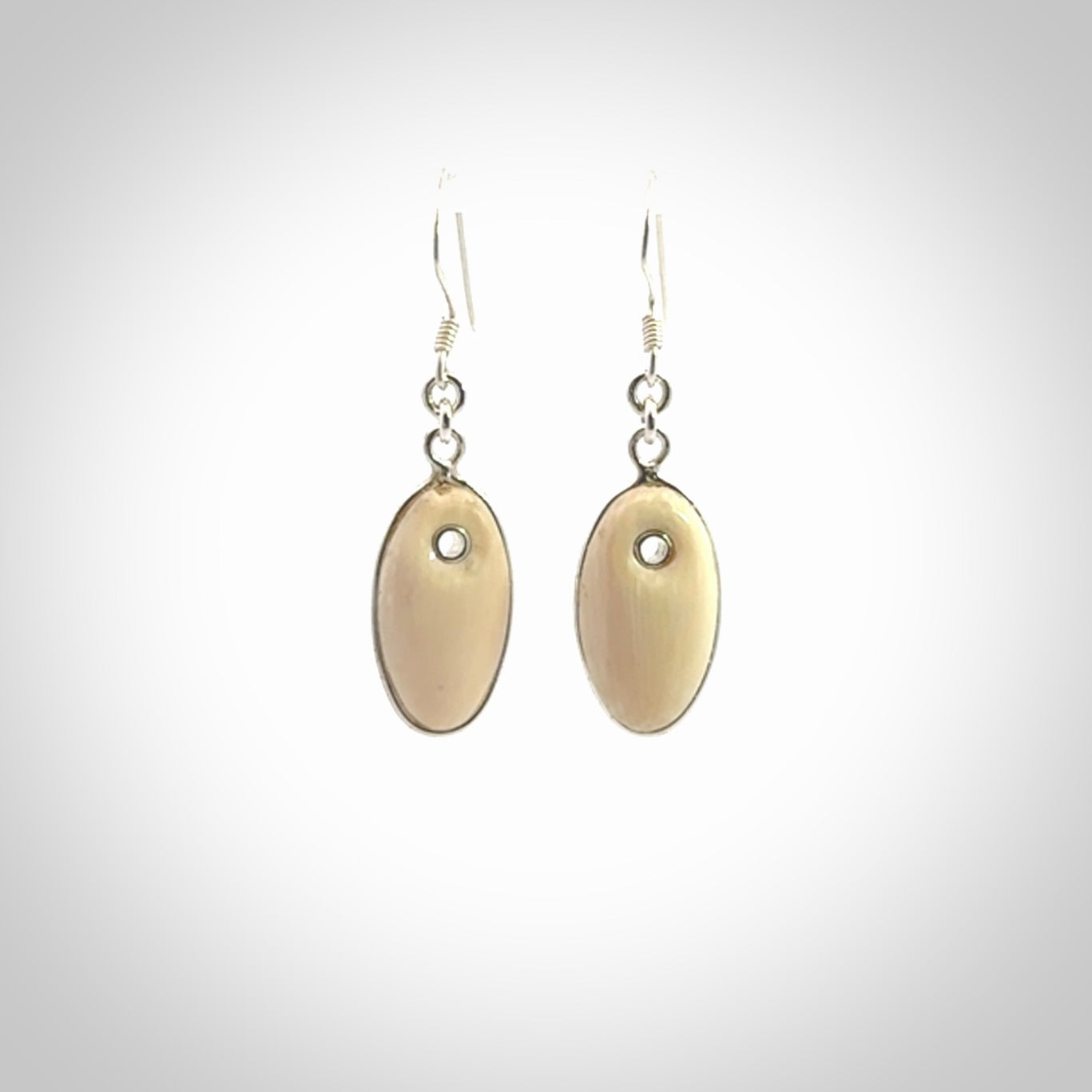 Hand carved woolly mammoth tusk earrings. Hand made by NZ Pacific for sale online.