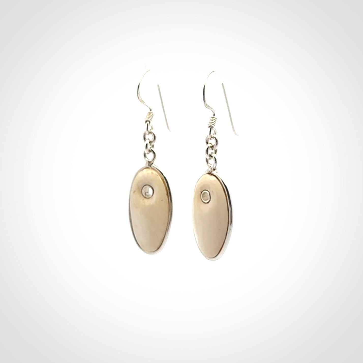 Hand carved woolly mammoth tusk earrings. Hand made by NZ Pacific for sale online.
