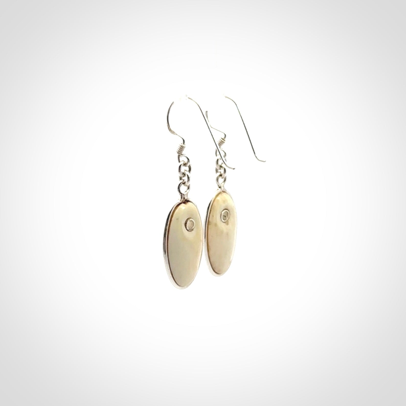 Hand carved woolly mammoth tusk earrings. Hand made by NZ Pacific for sale online.