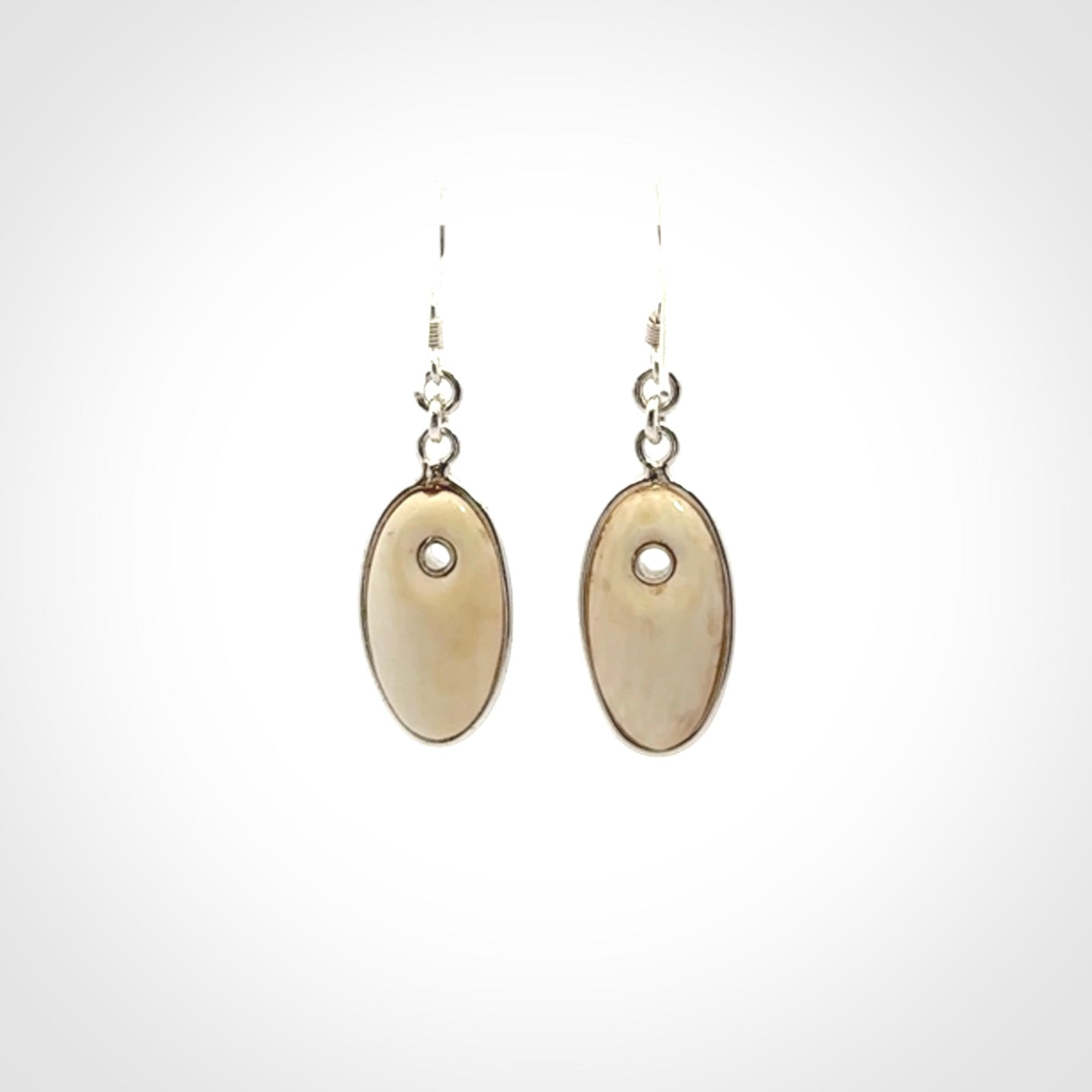 Hand carved woolly mammoth tusk earrings. Hand made by NZ Pacific for sale online.