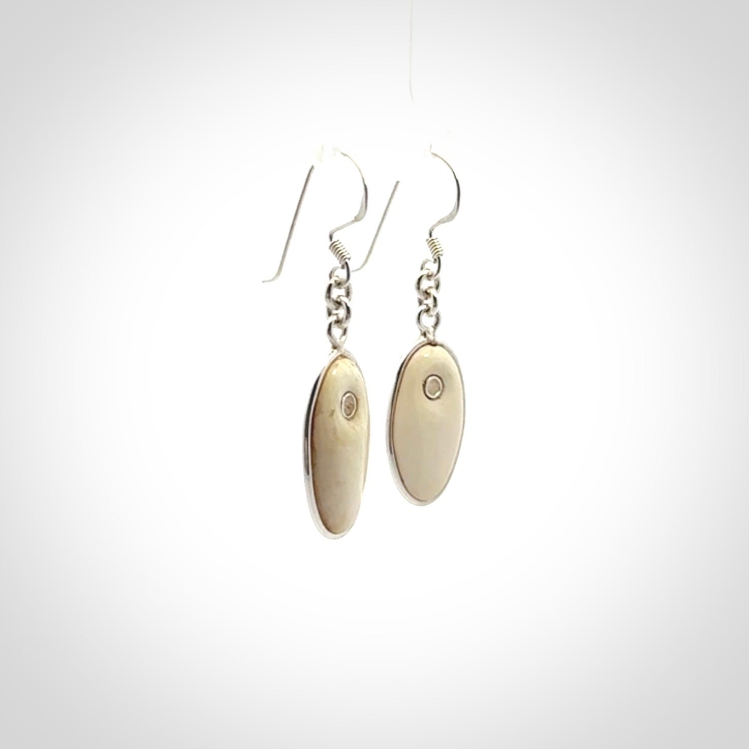 Hand carved woolly mammoth tusk earrings. Hand made by NZ Pacific for sale online.