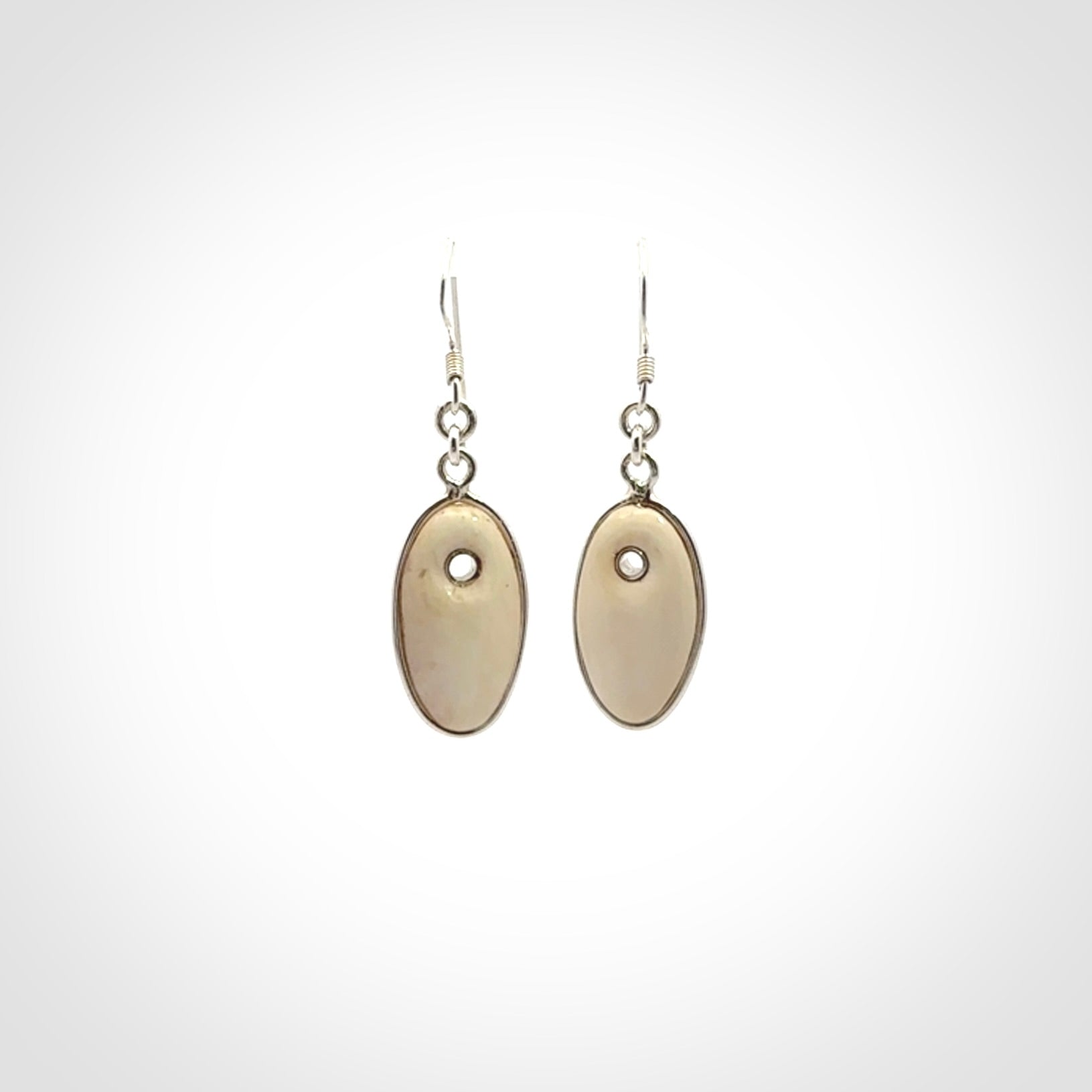 Hand carved woolly mammoth tusk earrings. Hand made by NZ Pacific for sale online.