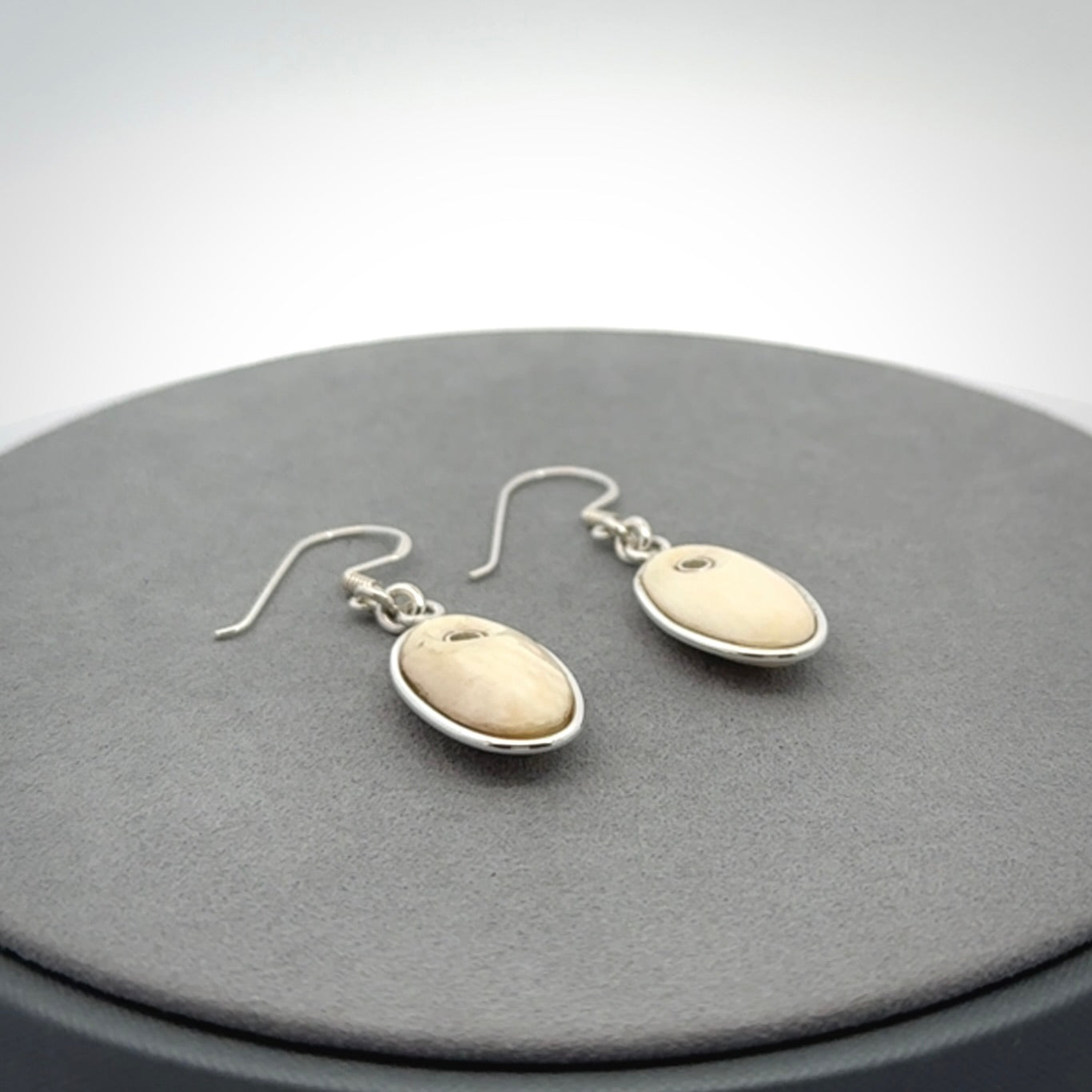 Hand carved woolly mammoth tusk earrings. Hand made by NZ Pacific for sale online.