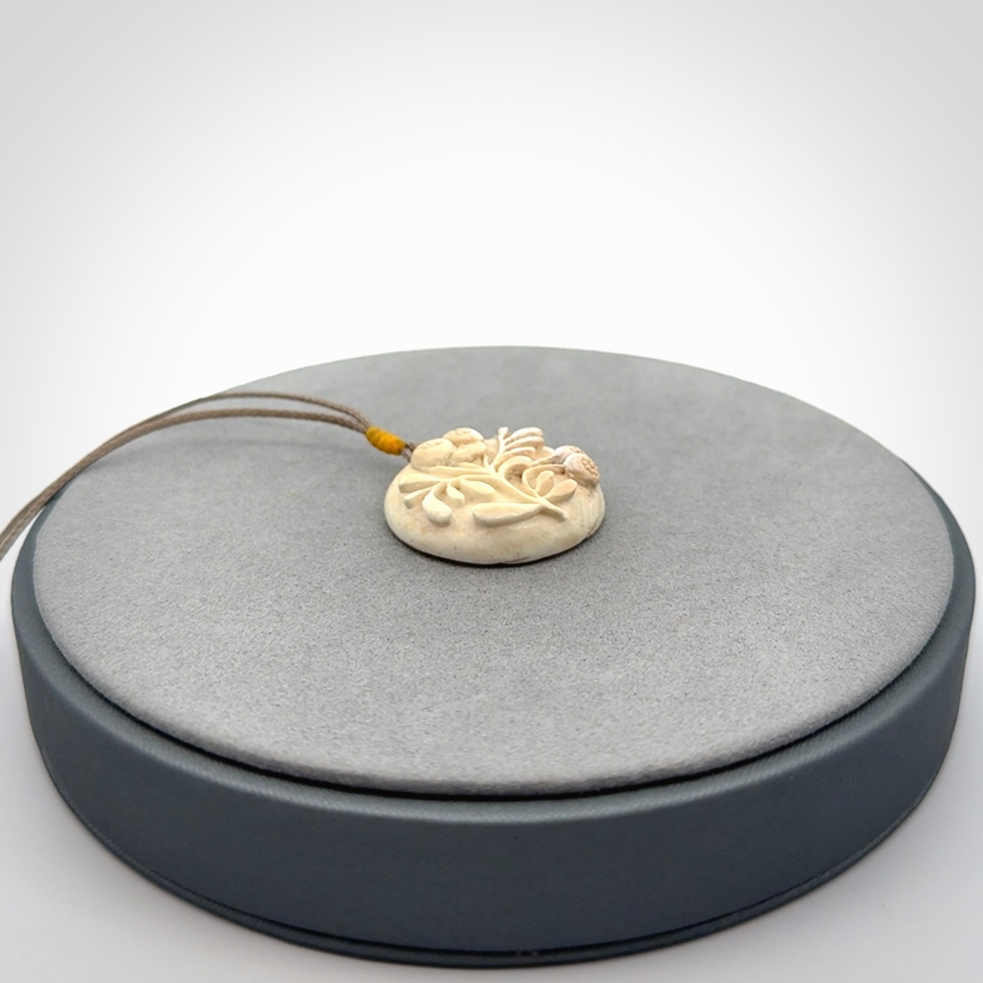 Flower pendant, Hand Carved in Woolly Mammoth Tusk