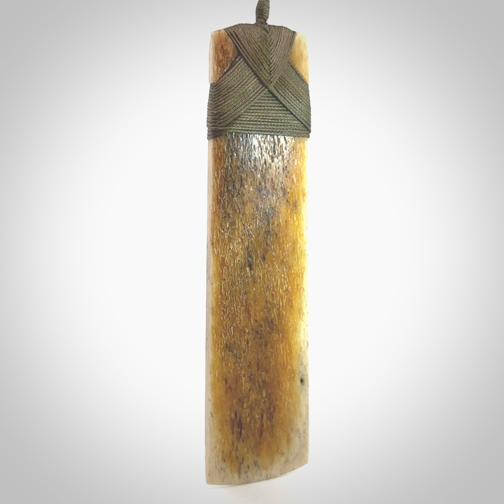 Hand carved Whale Bone Toki by Fumio Noguchi. One only New Zealand whale bone toki necklace for men and women. Unique New Zealand art to wear. Shipped to you on an adjustable cord.