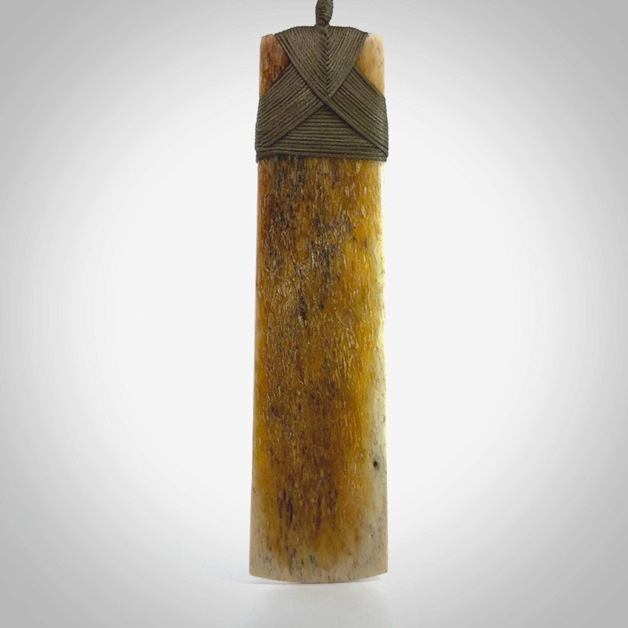 Hand carved Whale Bone Toki by Fumio Noguchi. One only New Zealand whale bone toki necklace for men and women. Unique New Zealand art to wear. Shipped to you on an adjustable cord.