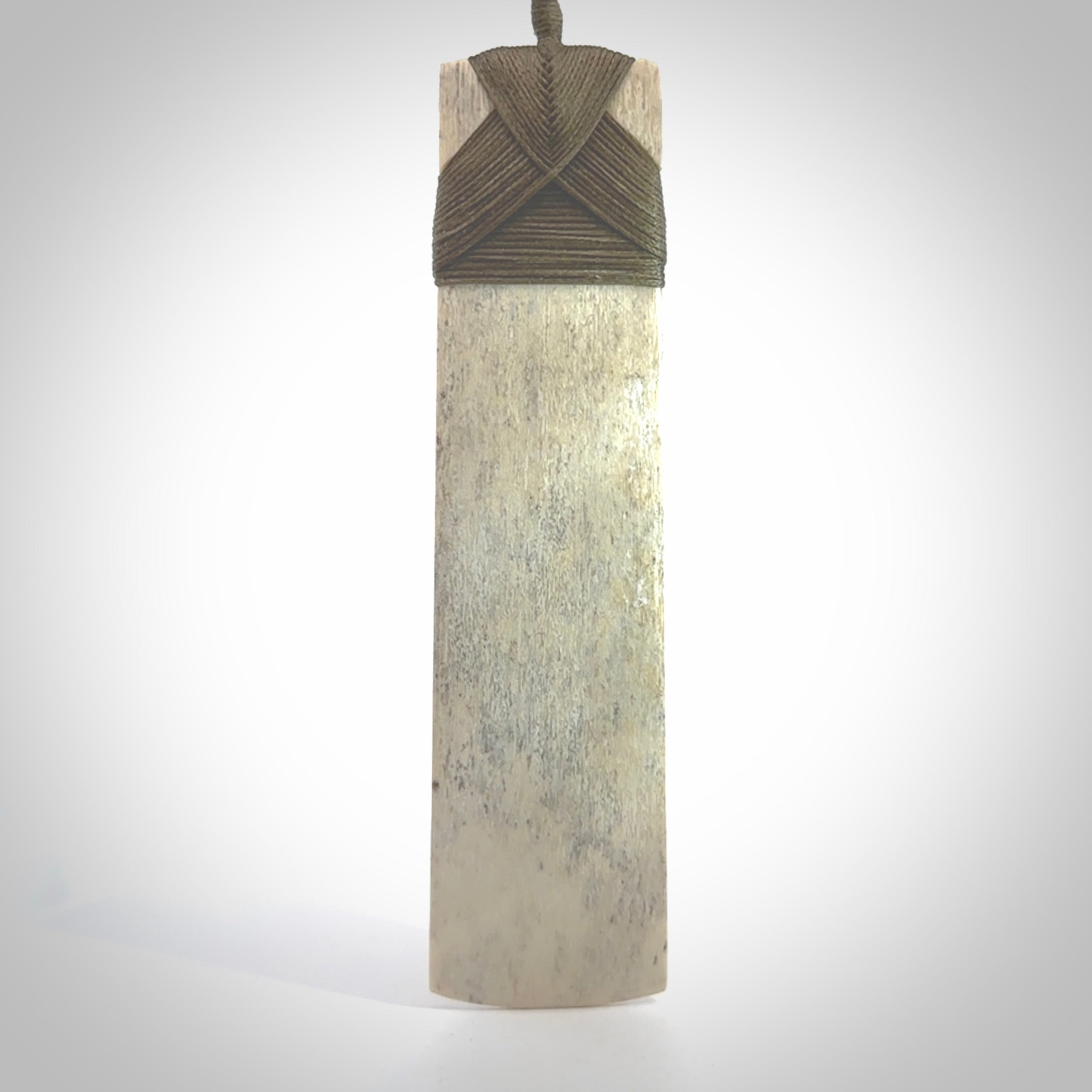 Hand carved Whale Bone Toki by Fumio Noguchi. One only New Zealand whale bone toki necklace for men and women. Unique New Zealand art to wear. Shipped to you on an adjustable cord.