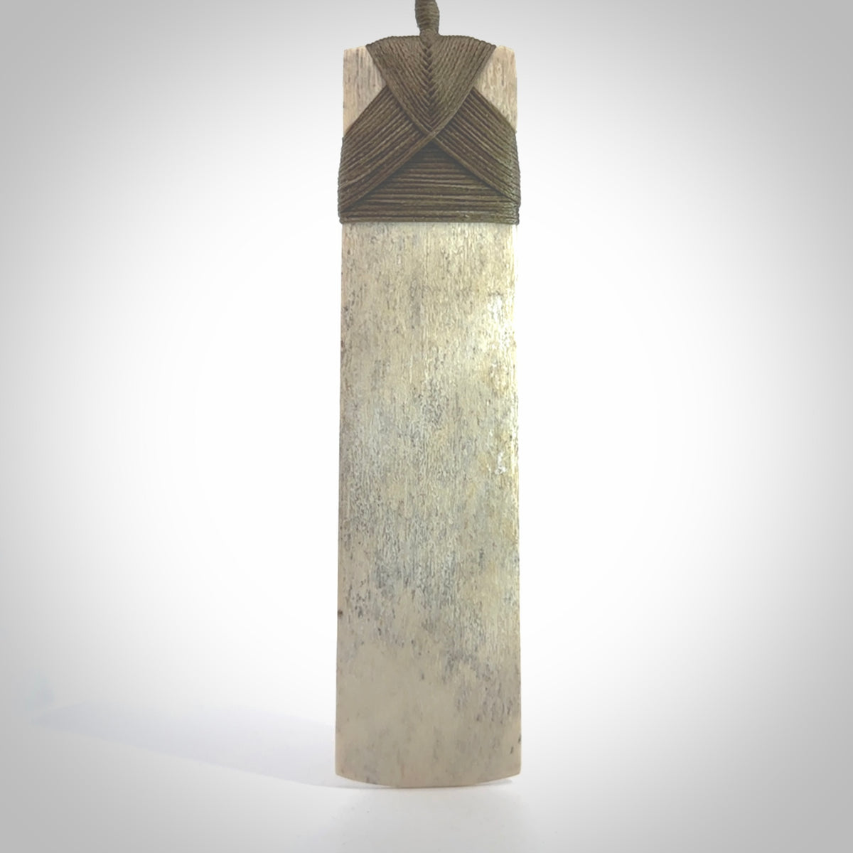Hand carved Whale Bone Toki by Fumio Noguchi. One only New Zealand whale bone toki necklace for men and women. Unique New Zealand art to wear. Shipped to you on an adjustable cord.