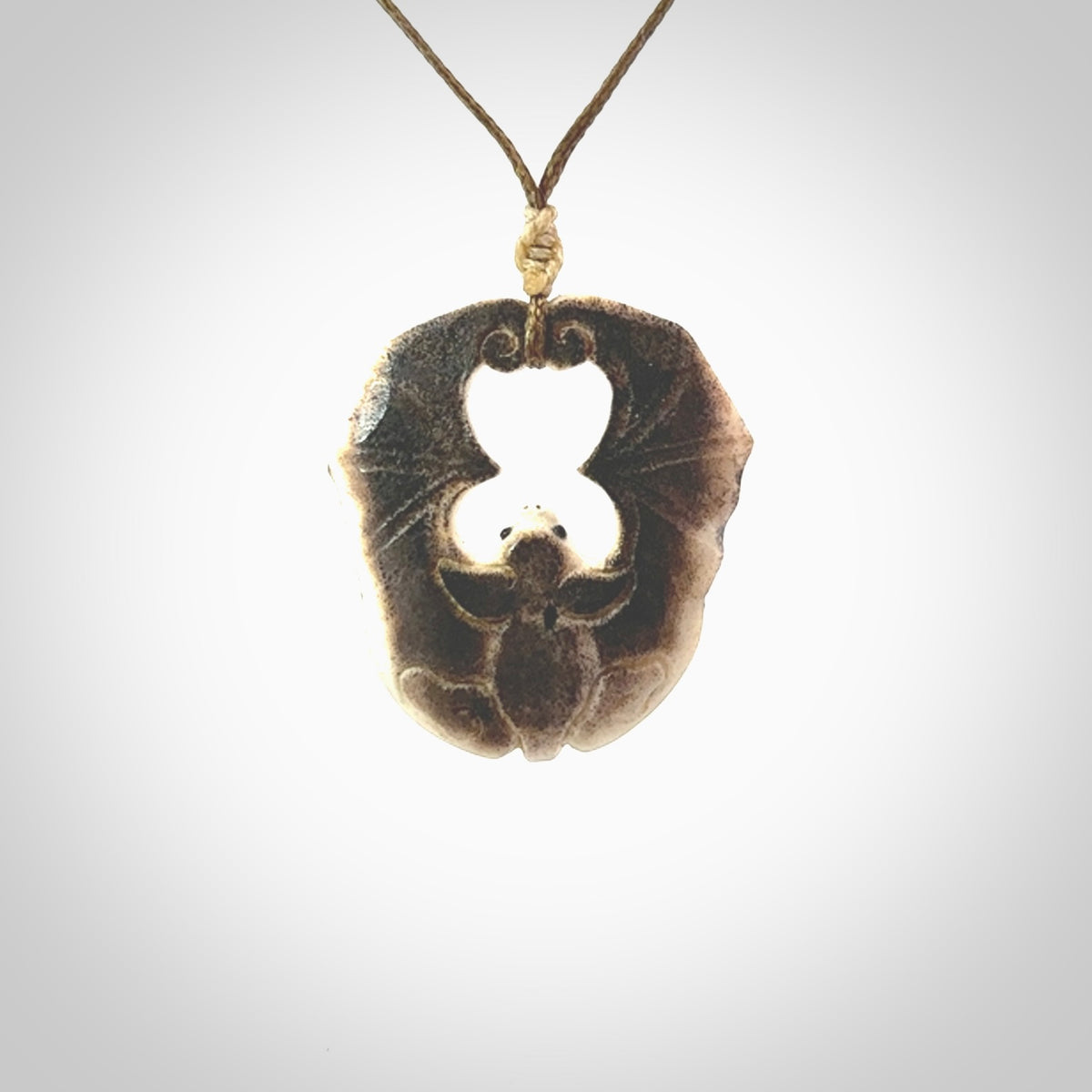 Hand carved bat Pendant. Made from Deer antler in New Zealand. Unique bat necklace hand made from deer antler by master bone carver Fumio Noguchi. Spectacular collectable work of art, made to wear. One only pendant, delivered to you with express courier.
