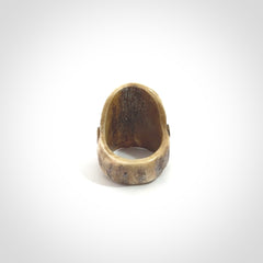 Hand carved Hotei good fortune ring. Made from Red Deer antler in New Zealand. Hand made from deer antler by master bone carver Fumio Noguchi. Spectacular collectable work of art, made to wear. One only ring, delivered to you with express courier.