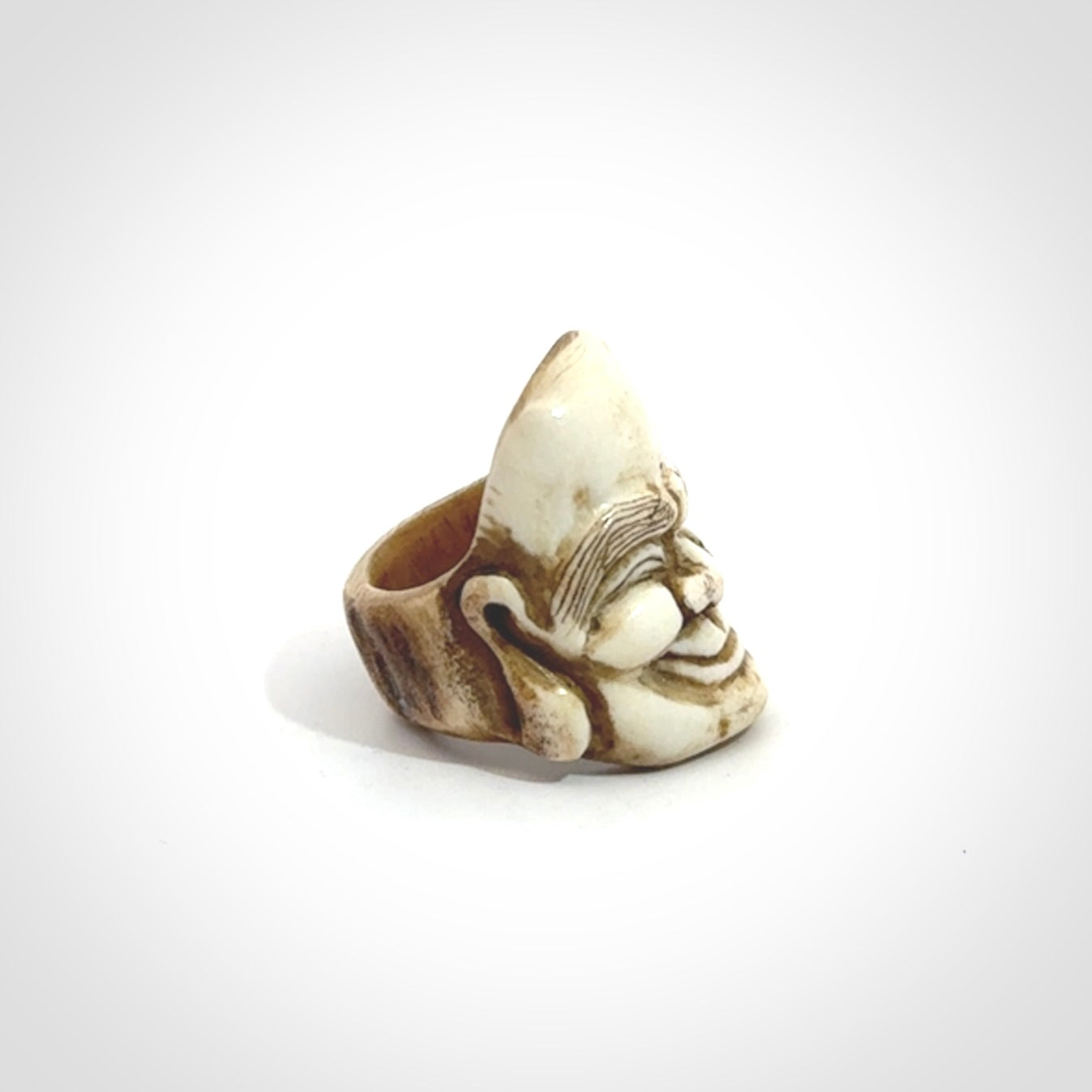 Hand carved Hotei good fortune ring. Made from Red Deer antler in New Zealand. Hand made from deer antler by master bone carver Fumio Noguchi. Spectacular collectable work of art, made to wear. One only ring, delivered to you with express courier.