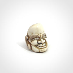 Hand carved Hotei good fortune ring. Made from Red Deer antler in New Zealand. Hand made from deer antler by master bone carver Fumio Noguchi. Spectacular collectable work of art, made to wear. One only ring, delivered to you with express courier.