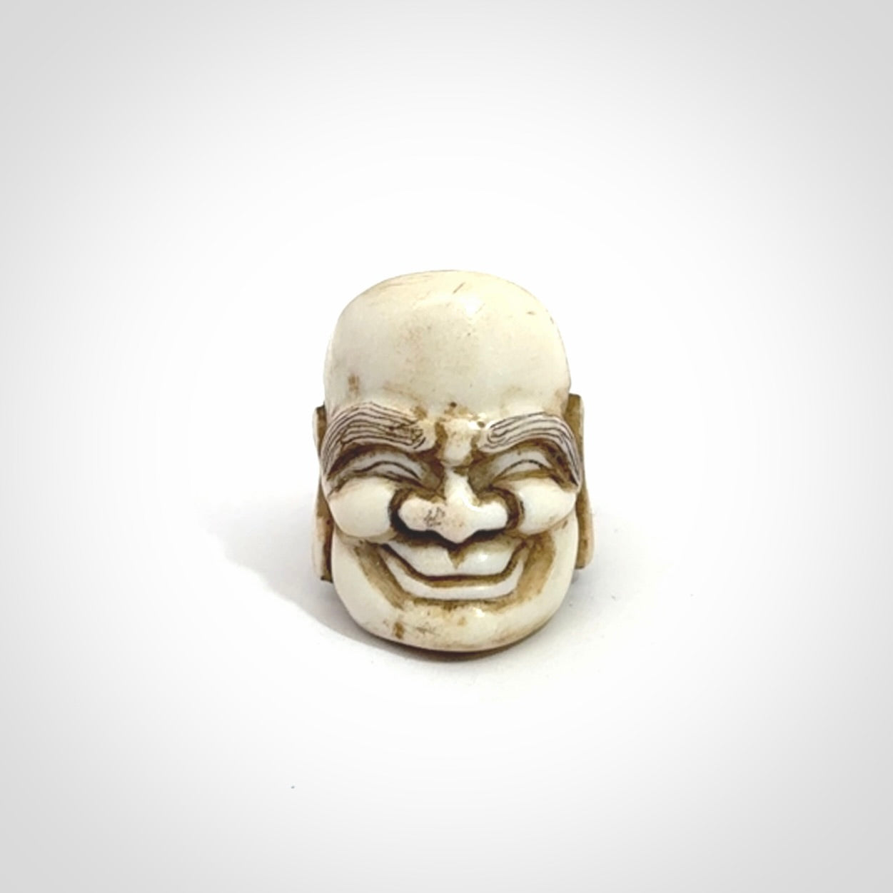 Hand carved Hotei good fortune ring. Made from Red Deer antler in New Zealand. Hand made from deer antler by master bone carver Fumio Noguchi. Spectacular collectable work of art, made to wear. One only ring, delivered to you with express courier.