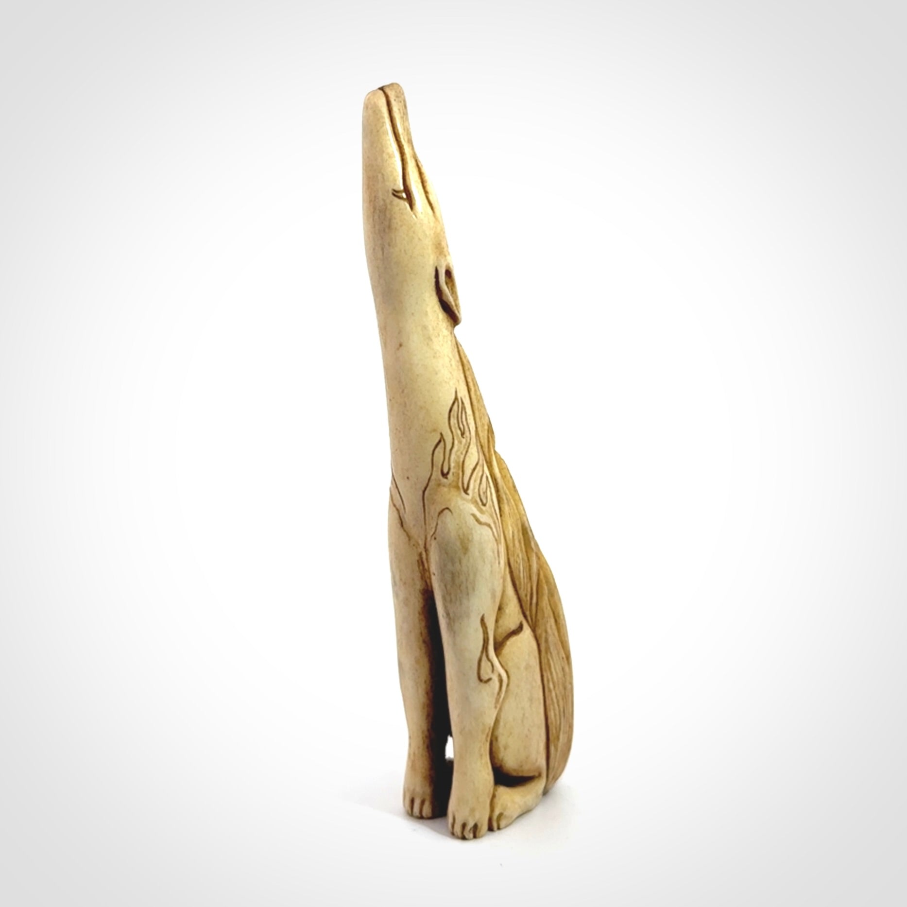 Hand carved incredible nine-tailed fox bone carving. A stunning work of art, beautifully replicating a nine-tailed fox. A one off collectors item that has been hand crafted to be worn or displayed.