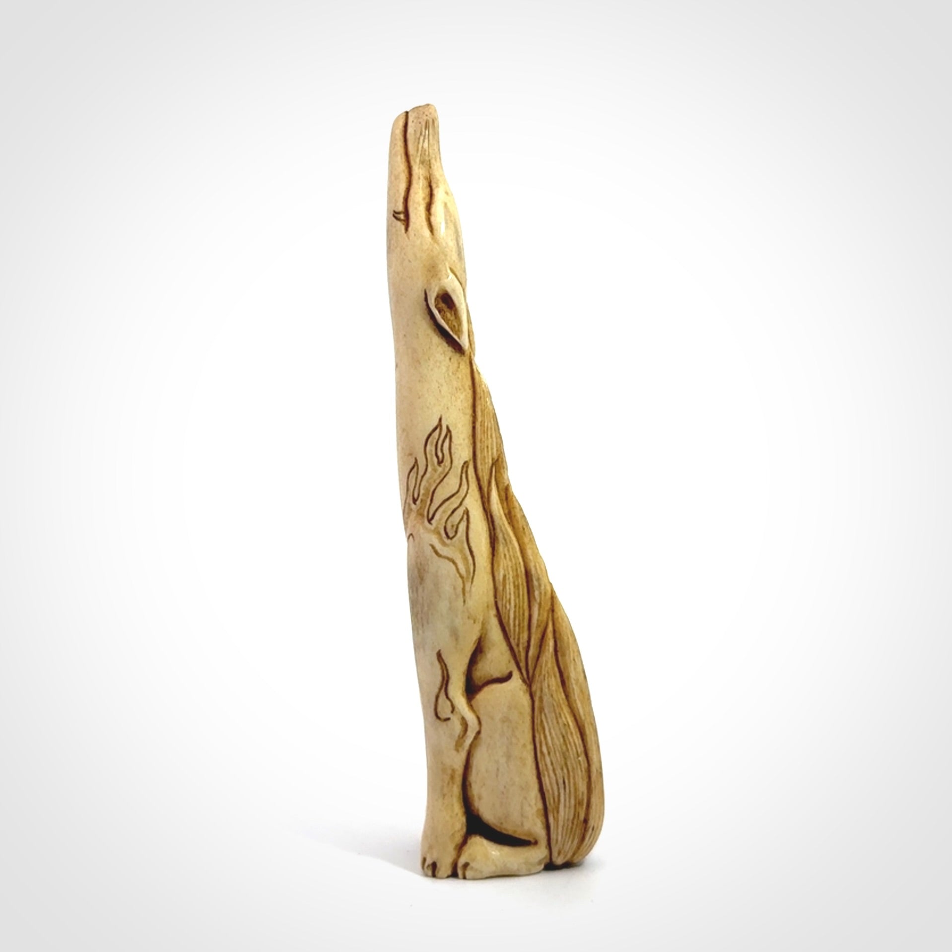 Hand carved incredible nine-tailed fox bone carving. A stunning work of art, beautifully replicating a nine-tailed fox. A one off collectors item that has been hand crafted to be worn or displayed.