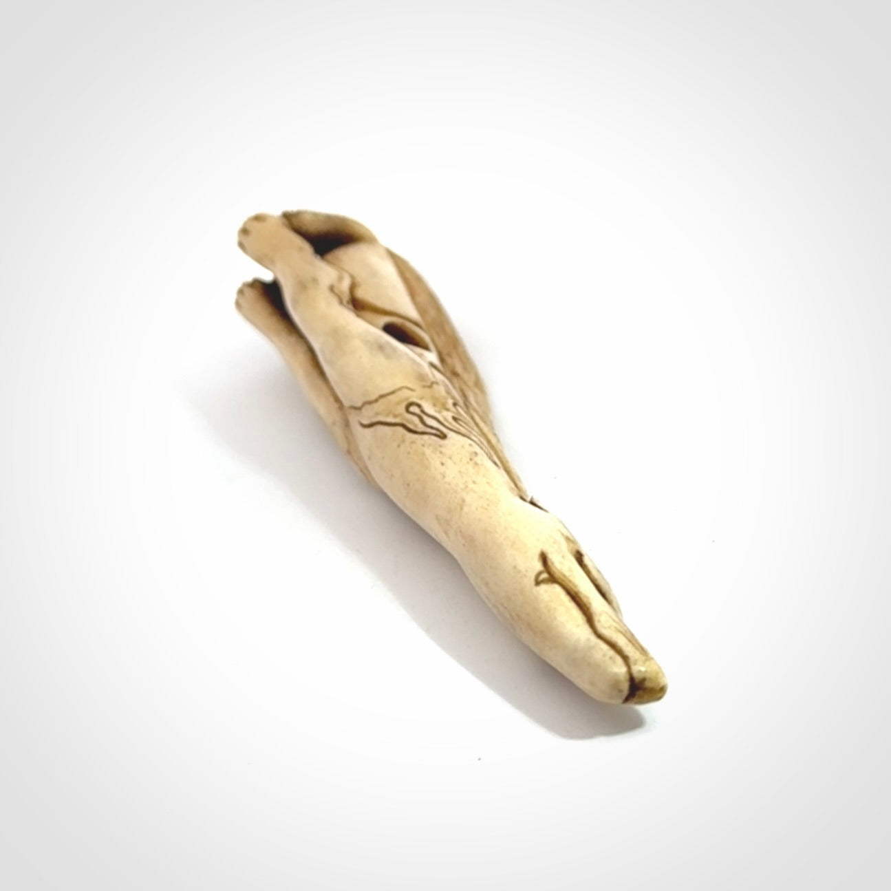 Hand carved incredible nine-tailed fox bone carving. A stunning work of art, beautifully replicating a nine-tailed fox. A one off collectors item that has been hand crafted to be worn or displayed.