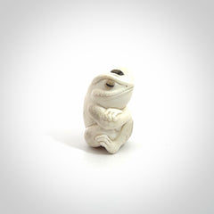 Hand carved meditating frog with slug on its head, made from Deer antler and black mother of pearl. Hand made by master bone carver Fumio Noguchi. Spectacular collectable work of art to display. One only, delivered to you at no extra cost with express courier.