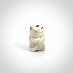 Hand carved meditating frog with slug on its head, made from Deer antler and black mother of pearl. Hand made by master bone carver Fumio Noguchi. Spectacular collectable work of art to display. One only, delivered to you at no extra cost with express courier.