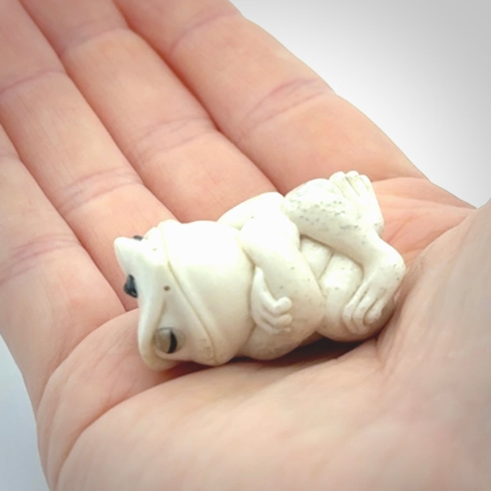 Hand carved meditating frog with slug on its head, made from Deer antler and black mother of pearl. Hand made by master bone carver Fumio Noguchi. Spectacular collectable work of art to display. One only, delivered to you at no extra cost with express courier.