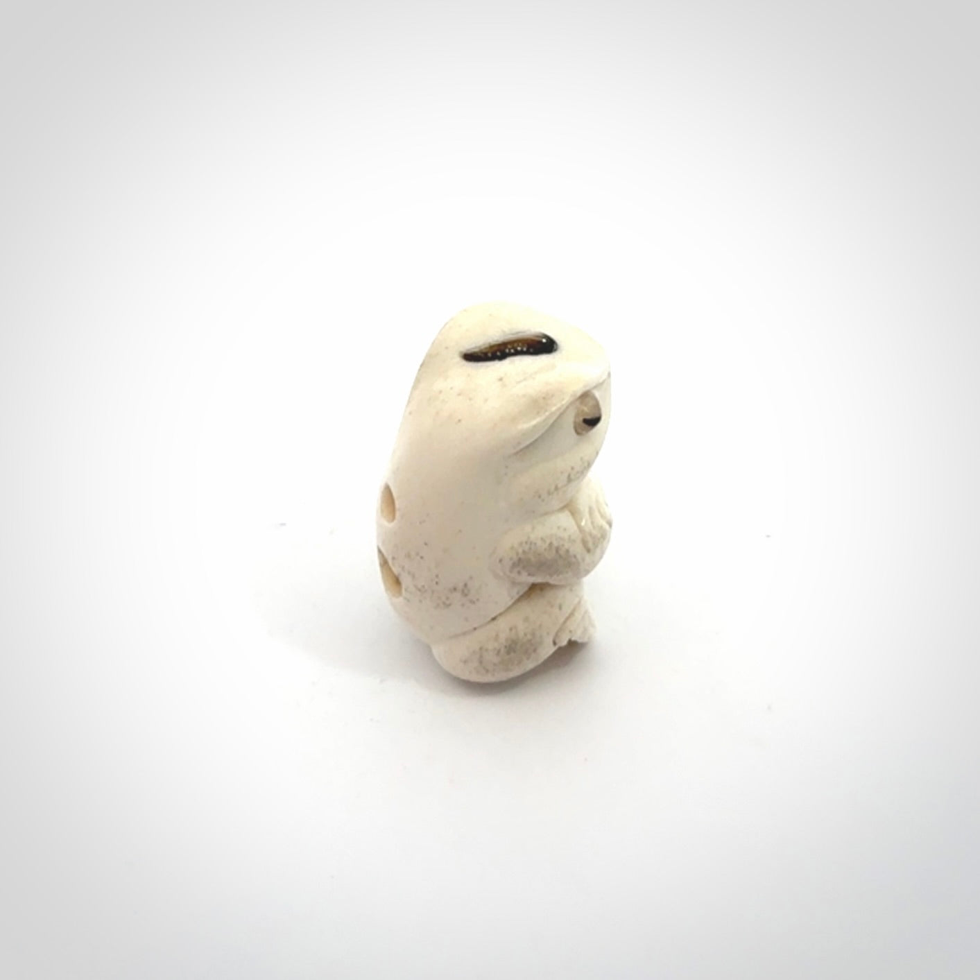 Hand carved meditating frog with slug on its head, made from Deer antler and black mother of pearl. Hand made by master bone carver Fumio Noguchi. Spectacular collectable work of art to display. One only, delivered to you at no extra cost with express courier.