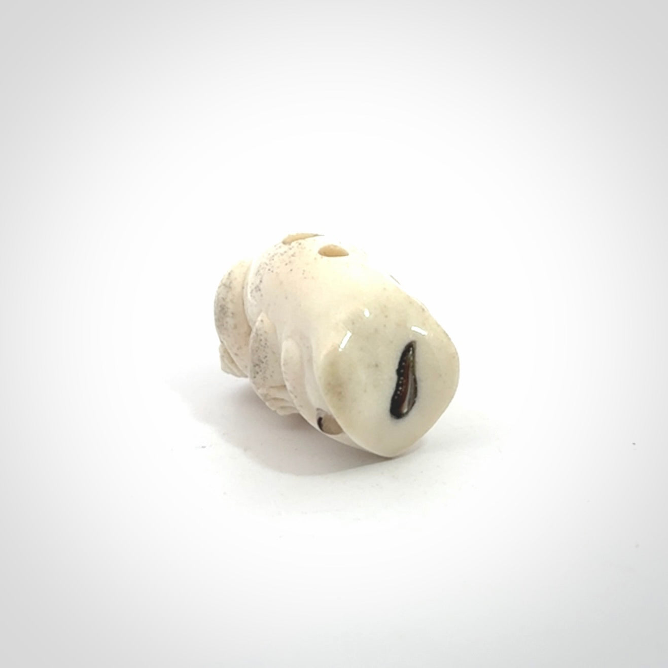 Hand carved meditating frog with slug on its head, made from Deer antler and black mother of pearl. Hand made by master bone carver Fumio Noguchi. Spectacular collectable work of art to display. One only, delivered to you at no extra cost with express courier.