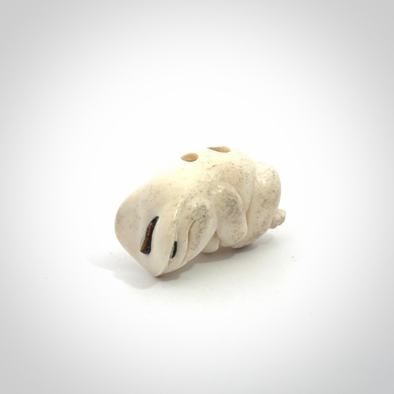 Hand carved meditating frog with slug on its head, made from Deer antler and black mother of pearl. Hand made by master bone carver Fumio Noguchi. Spectacular collectable work of art to display. One only, delivered to you at no extra cost with express courier.