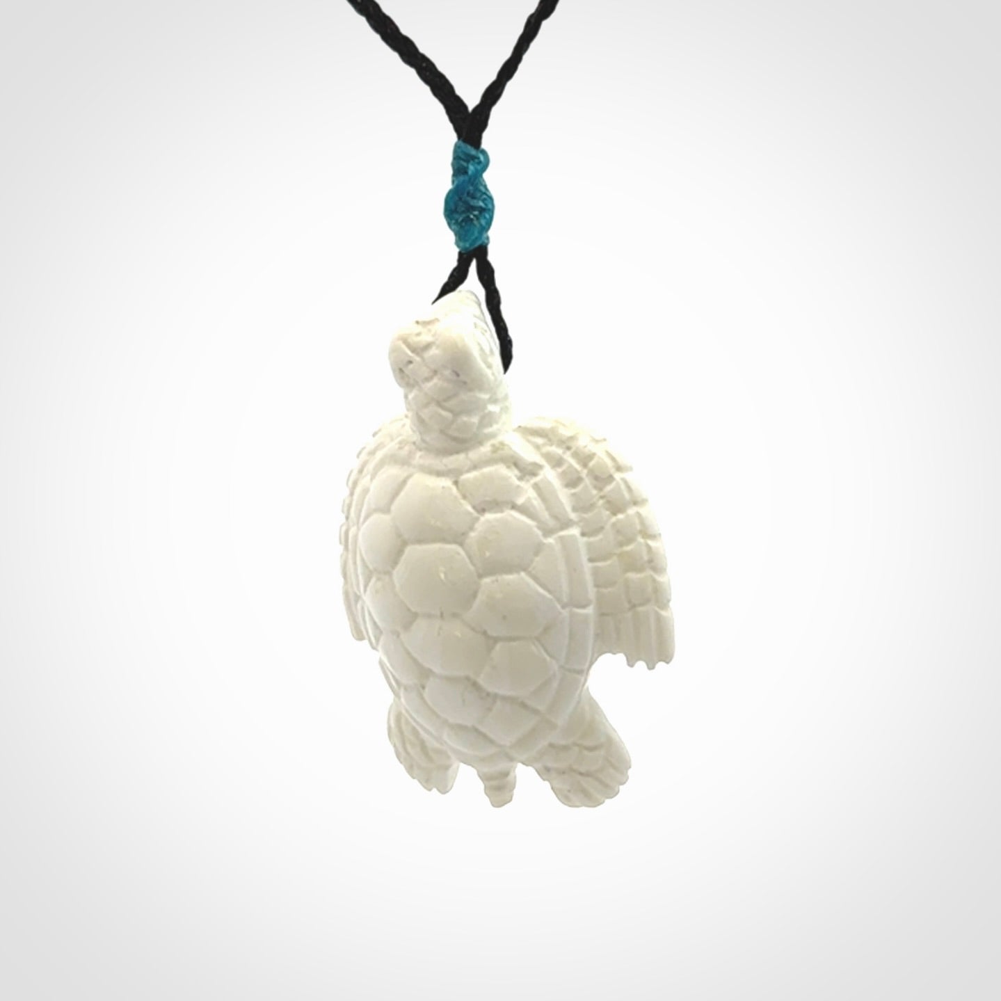 Hand carved white onyx turtle pendant. Unique handmade jewellery for sale online.