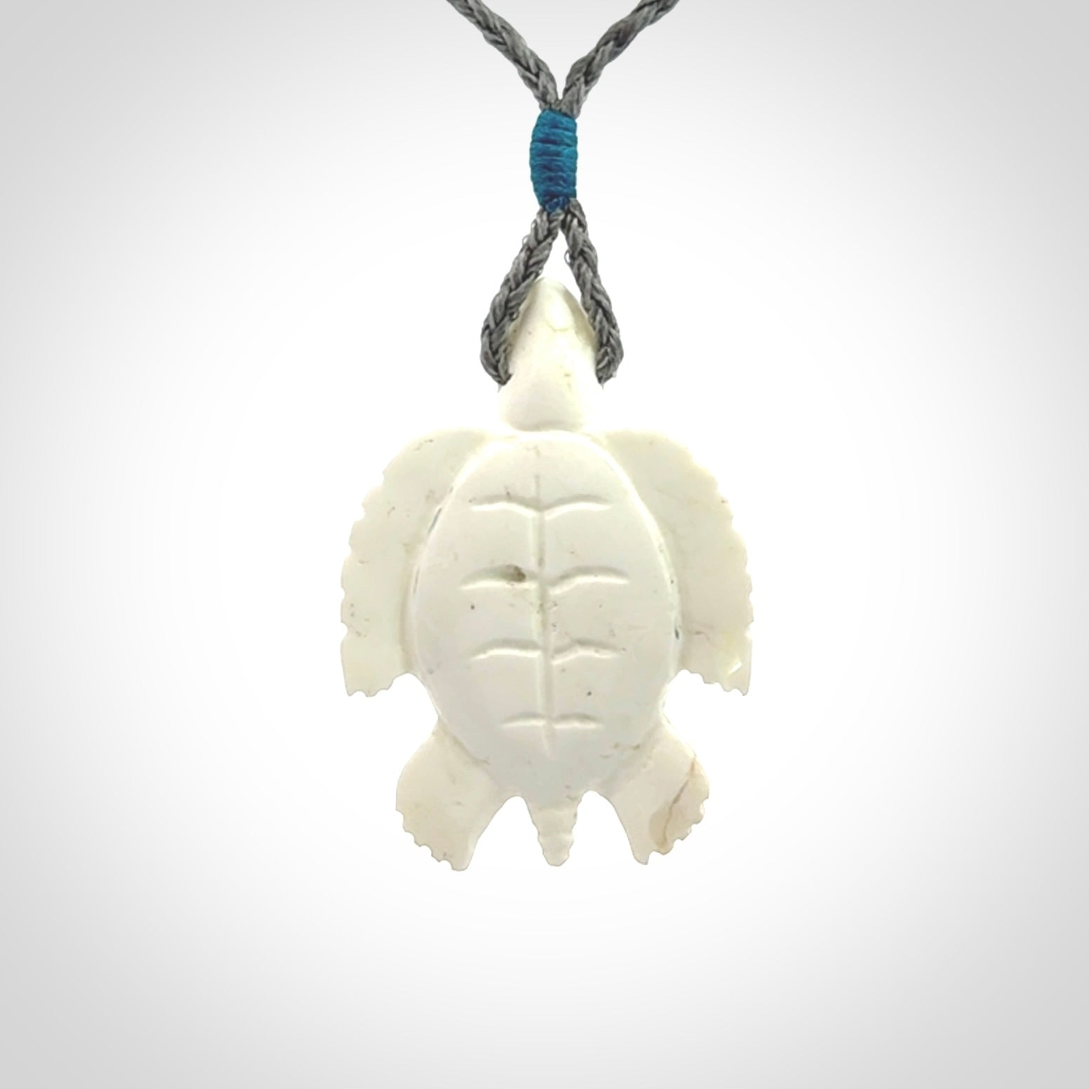 Hand carved white onyx turtle pendant. Unique handmade jewellery for sale online.