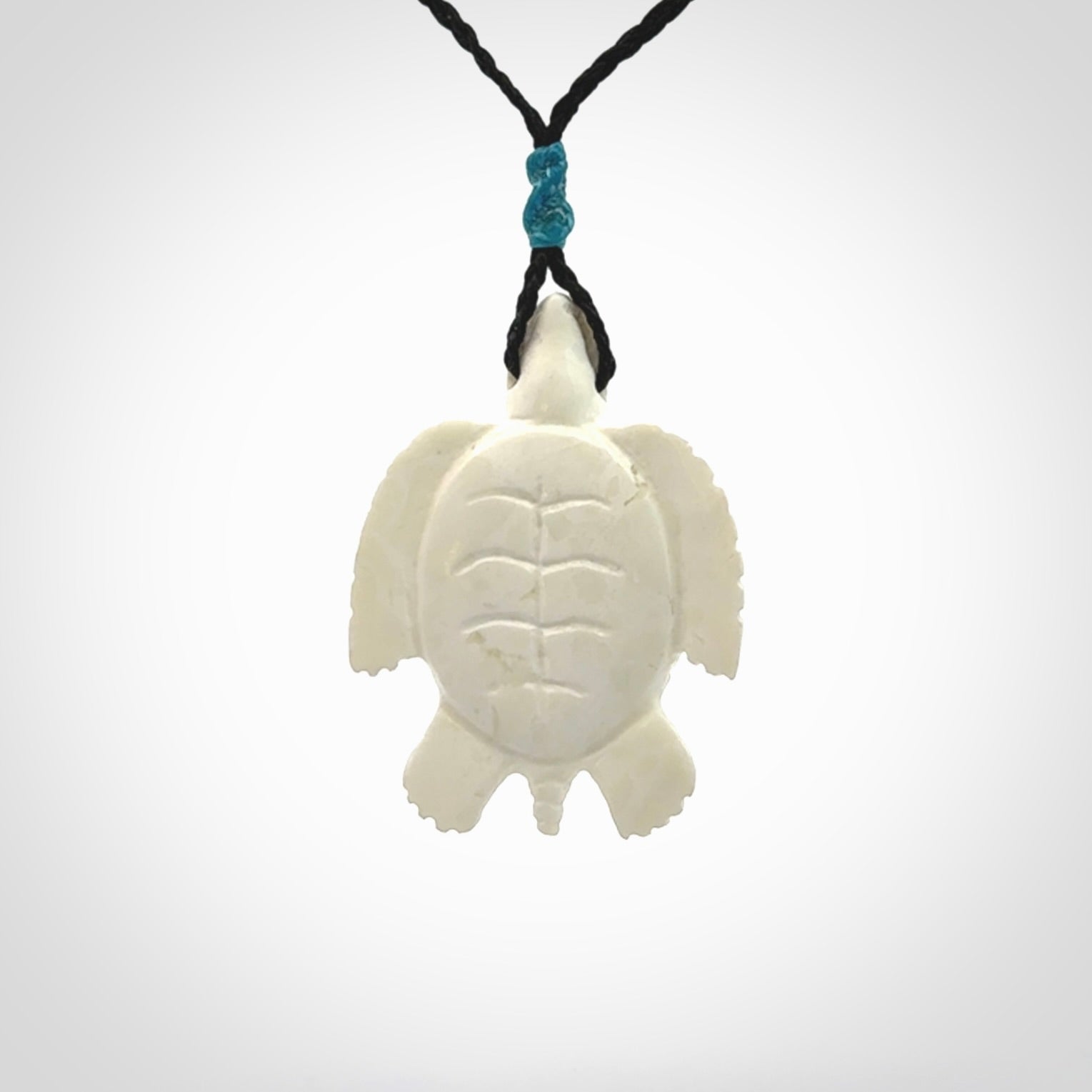 Hand carved white onyx turtle pendant. Unique handmade jewellery for sale online.