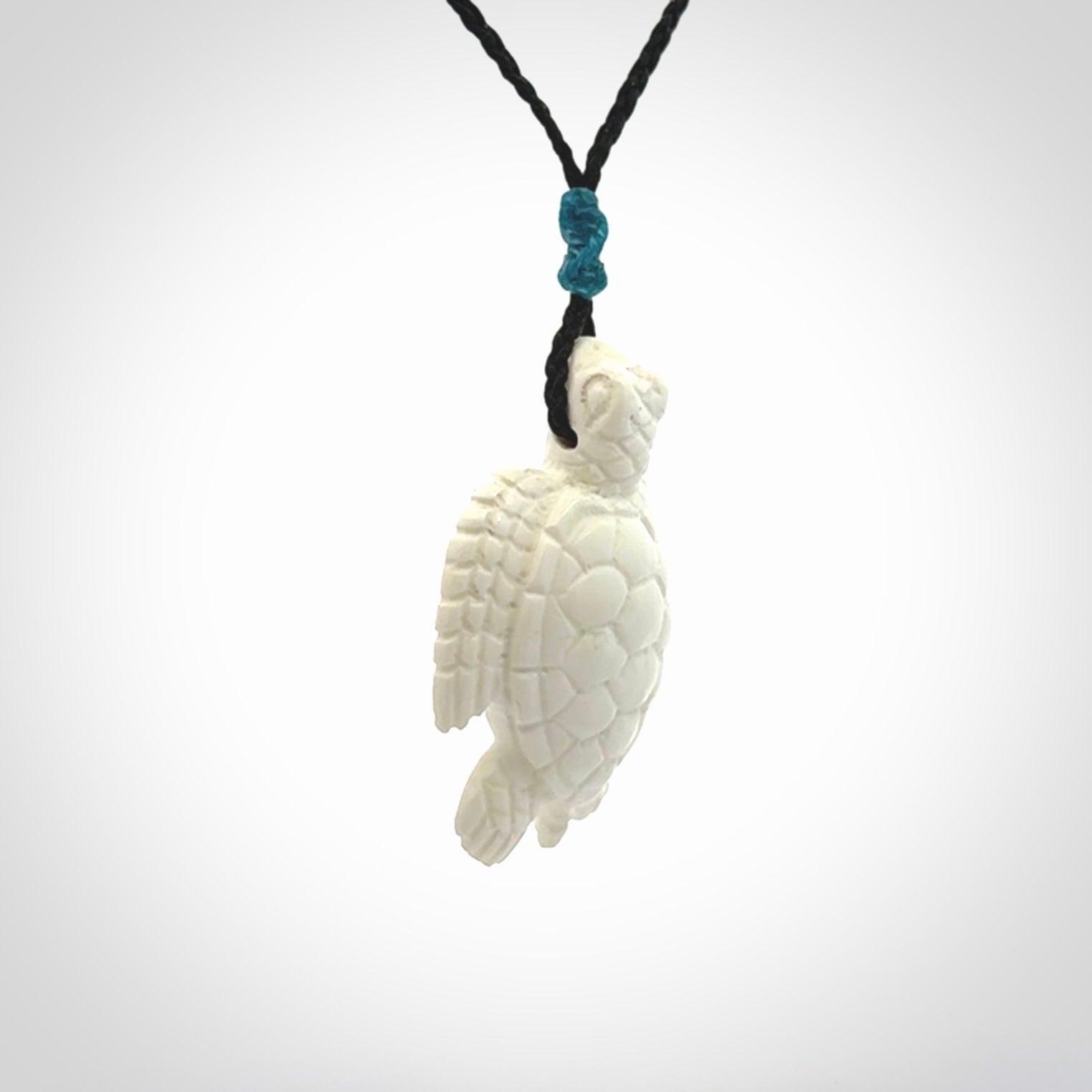 Hand carved white onyx turtle pendant. Unique handmade jewellery for sale online.