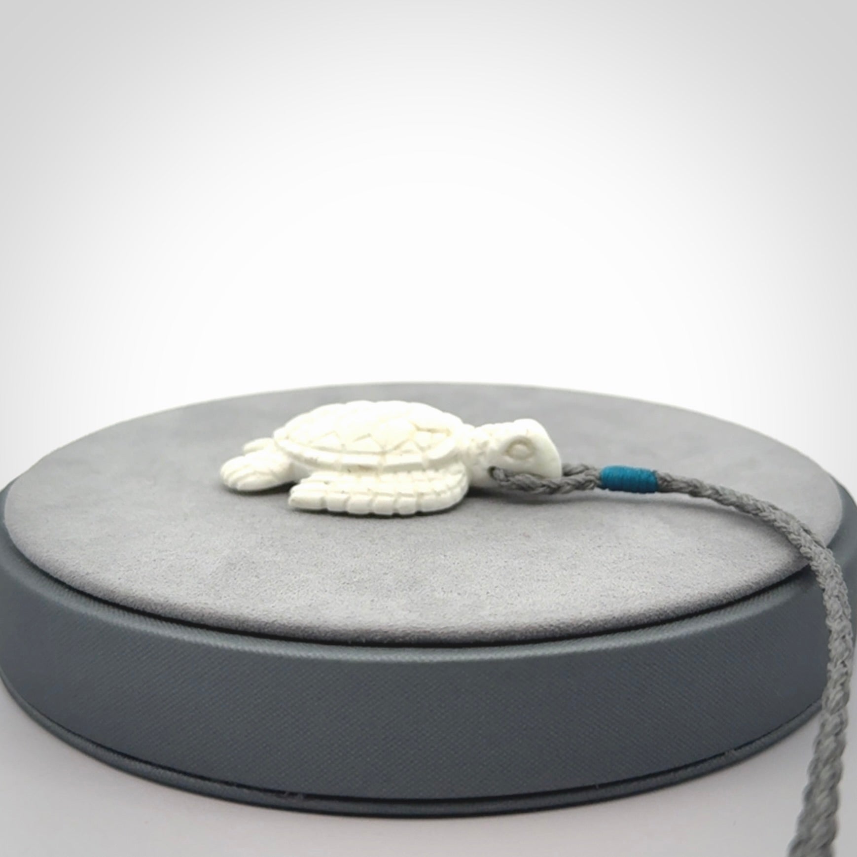 Hand carved white onyx turtle pendant. Unique handmade jewellery for sale online.