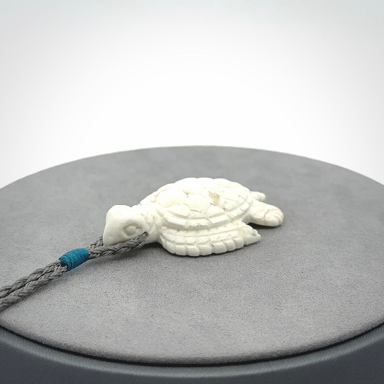 Hand carved white onyx turtle pendant. Unique handmade jewellery for sale online.