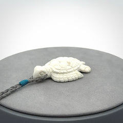 Hand carved white onyx turtle pendant. Unique handmade jewellery for sale online.