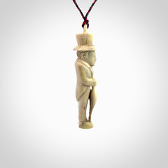 This unique contemporary hunchback with red pepper piece is hand carved in deer antler, bone and is a one off pendant. It is a delightful, large sized and artistic piece of jewellery. One only necklace. We provide this pendant on a blue and red adjustable cord.