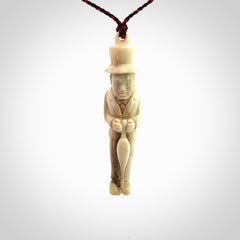 This unique contemporary hunchback with red pepper piece is hand carved in deer antler, bone and is a one off pendant. It is a delightful, large sized and artistic piece of jewellery. One only necklace. We provide this pendant on a blue and red adjustable cord.