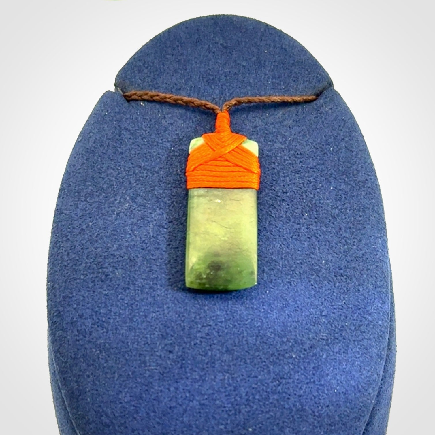 Unique small Jade Toki hand carved here in New Zealand, the cord is adjustable.