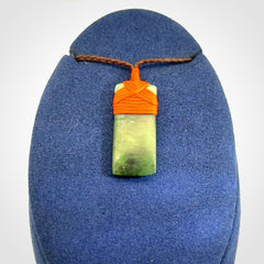 Unique small Jade Toki hand carved here in New Zealand, the cord is adjustable.