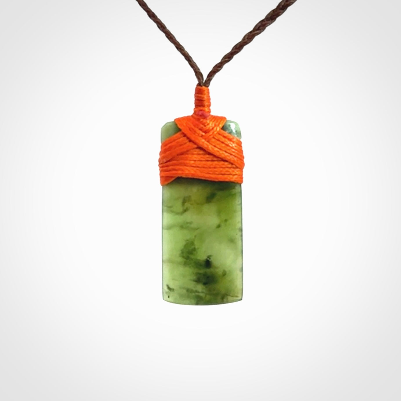 Unique small Jade Toki hand carved here in New Zealand, the cord is adjustable.